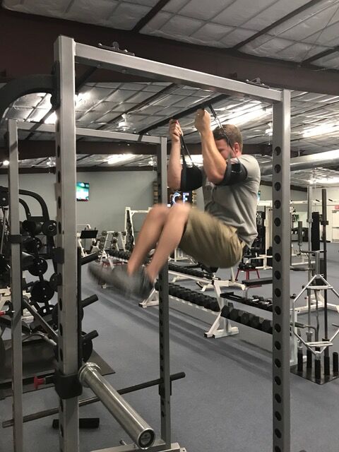 A member doing pull-ups