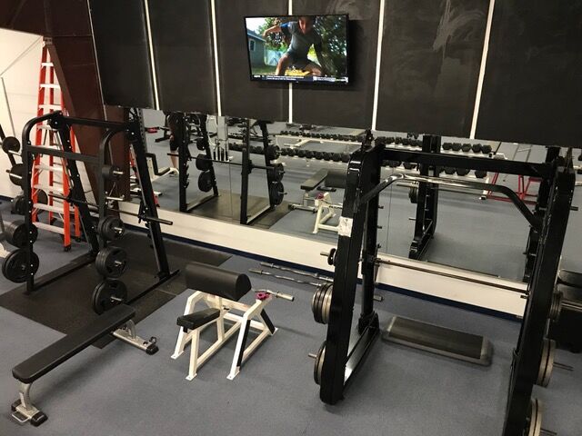 Squat racks and dumbbells
