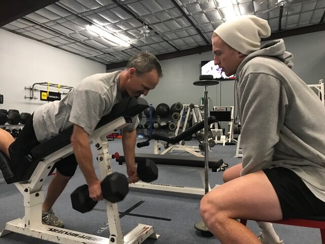 A coached dumbbell row