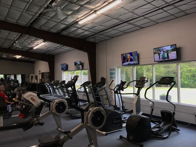 Cardio machines along the windows