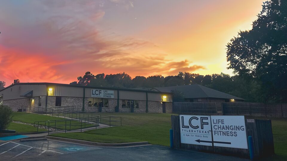 The Life Changing Fitness building and sign at sunset on New Copeland Road in Tyler, Texas